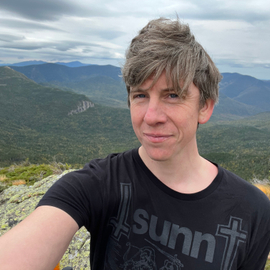 Selfie of Daniel Schiels from the peak